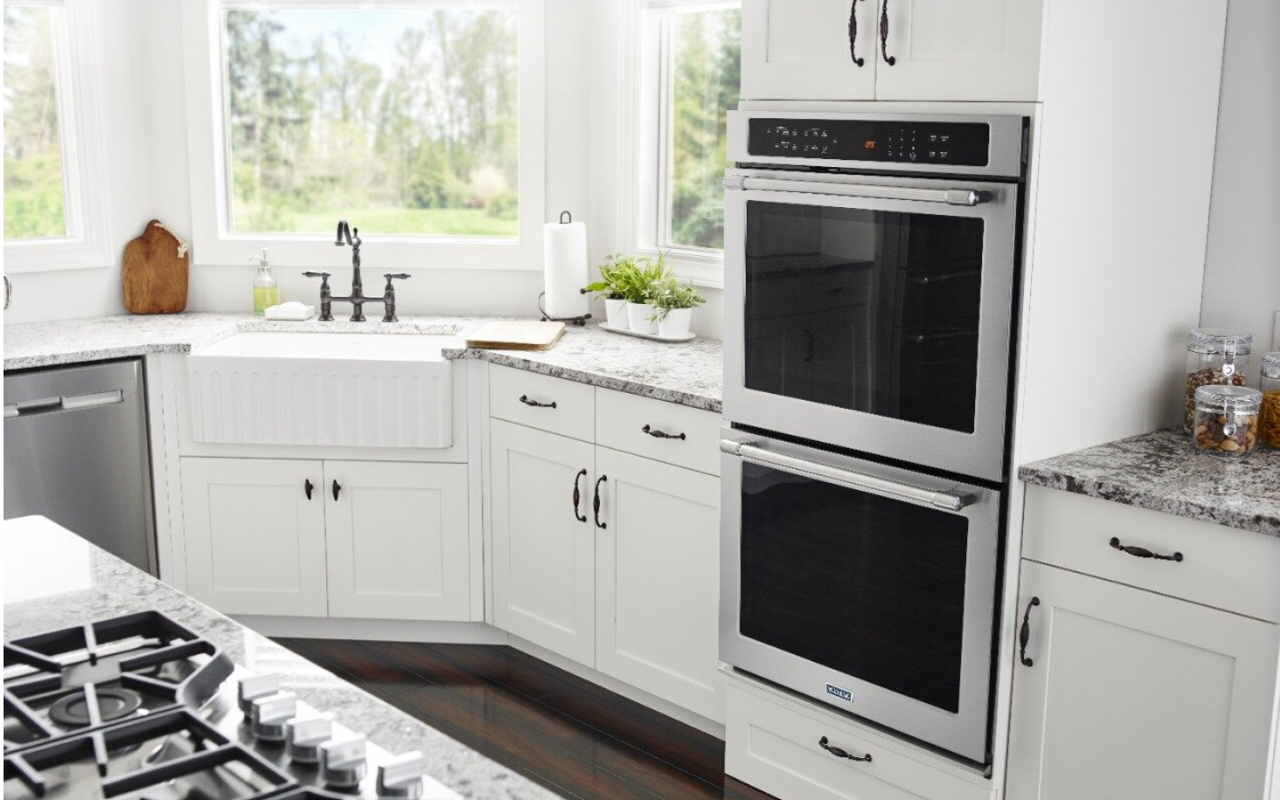  Farmhouse-style white kitchen featuring a Maytag® wall oven
