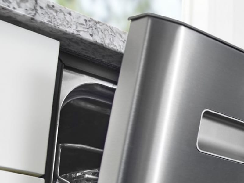 A closeup of an open dishwasher