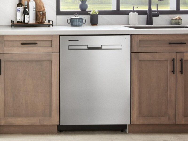 A Maytag® dishwasher in a kitchen with light brown cabinets