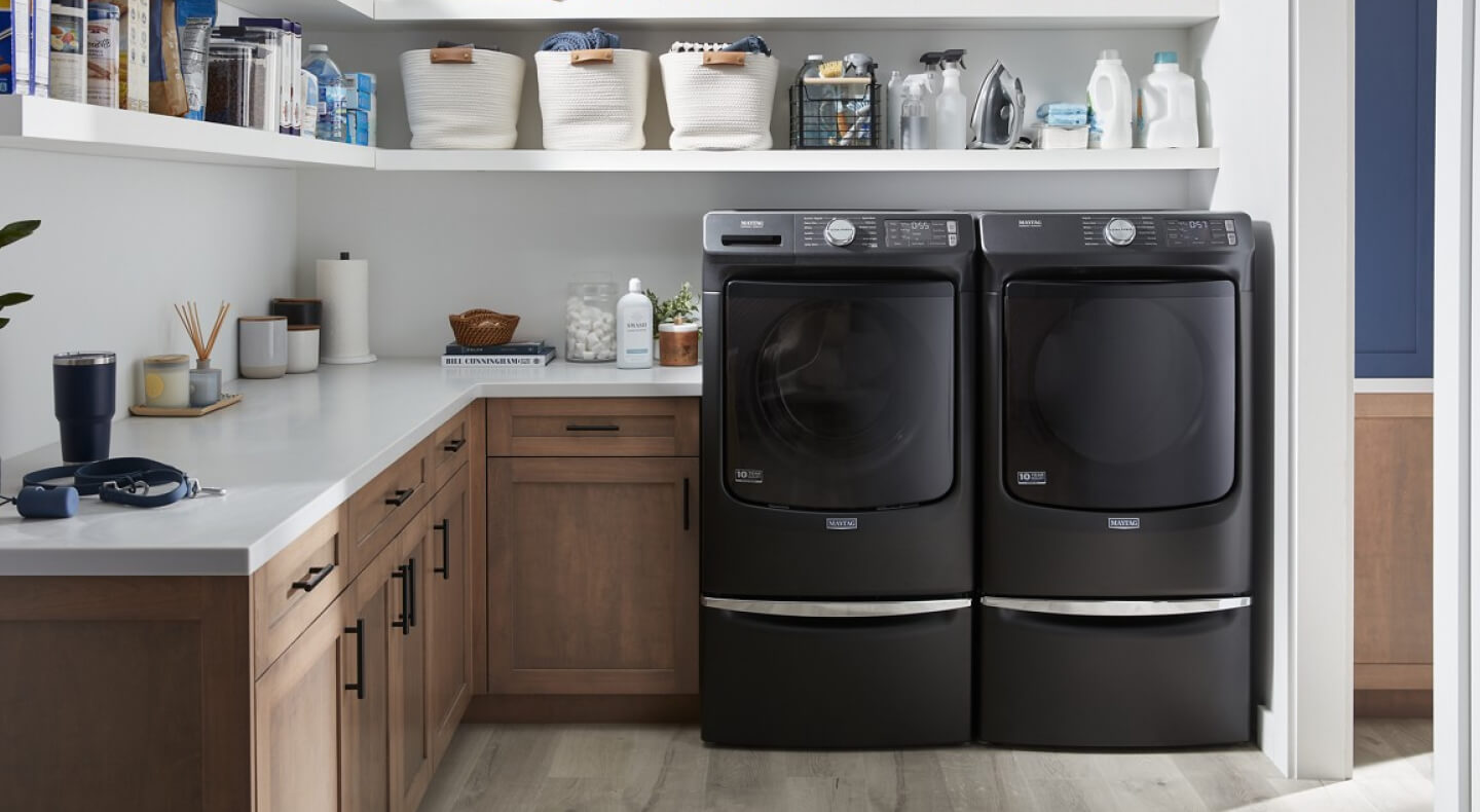 A Maytag® washer and dryer pair in a laundry room