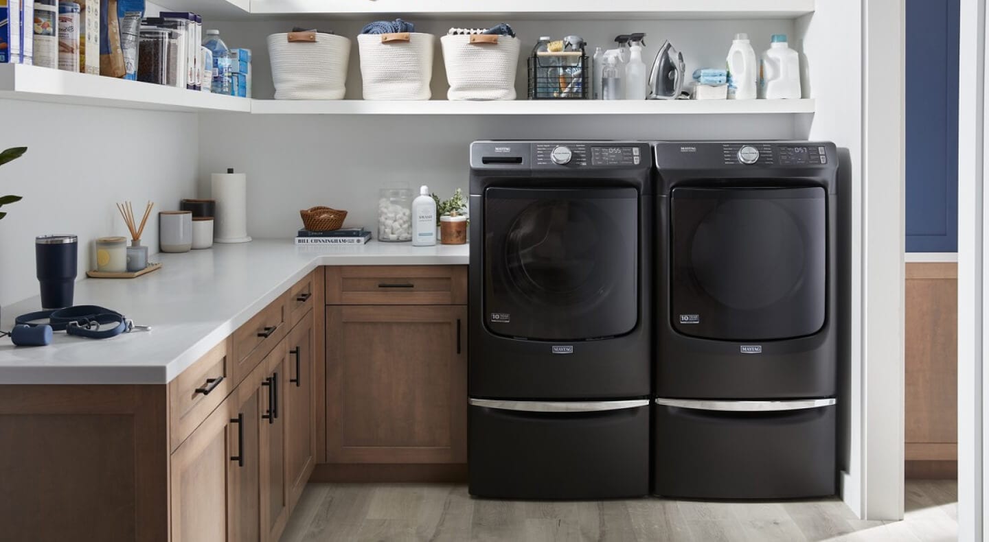 A Maytag® washer and dryer pair in a laundry room