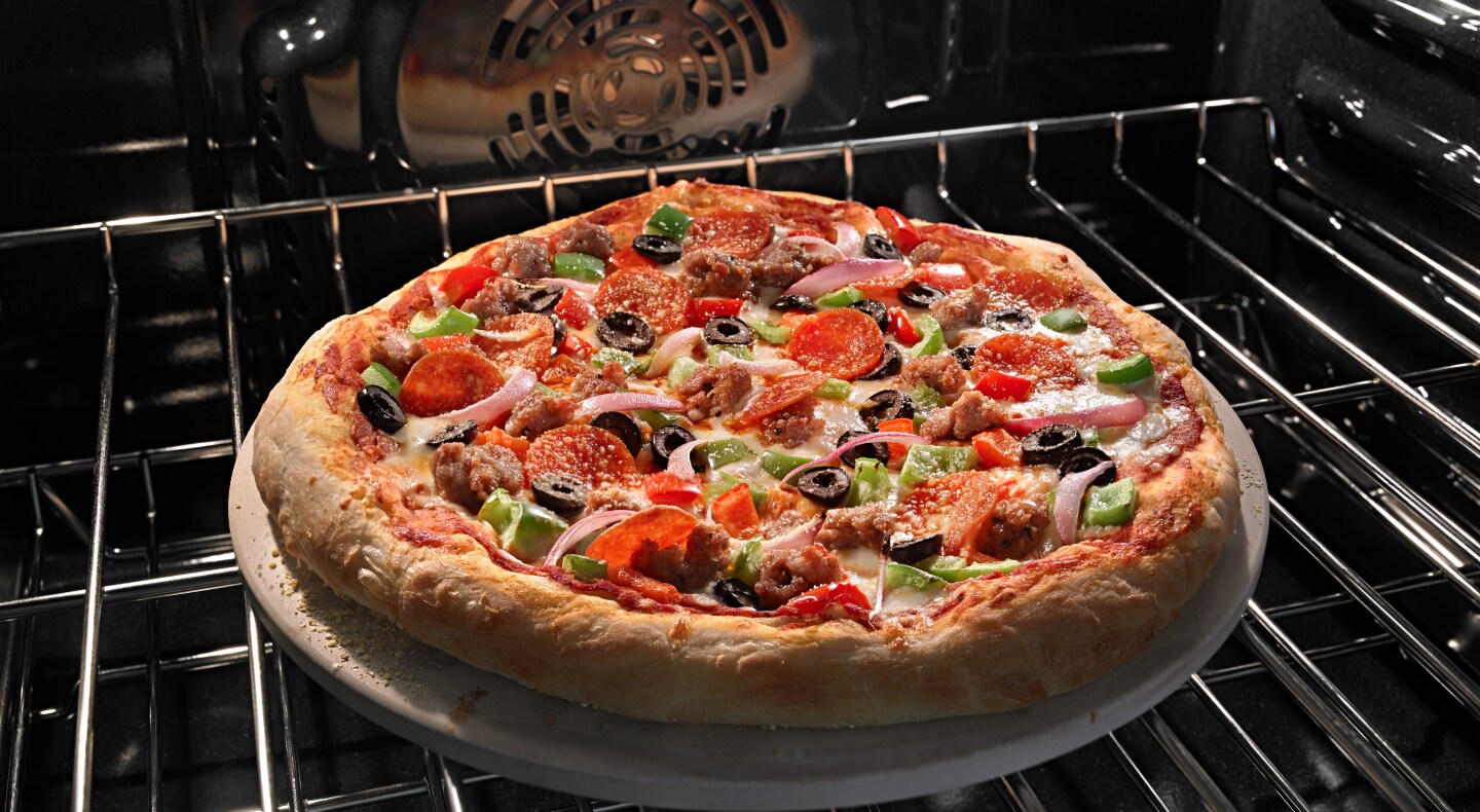 Pizza baking in oven Pizza baking in oven