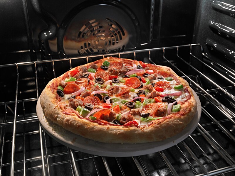 Pizza baking in oven Pizza baking in oven