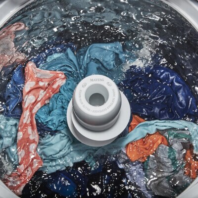 Laundry washing around an agitator