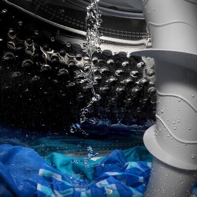 Water pouring into a washing machine