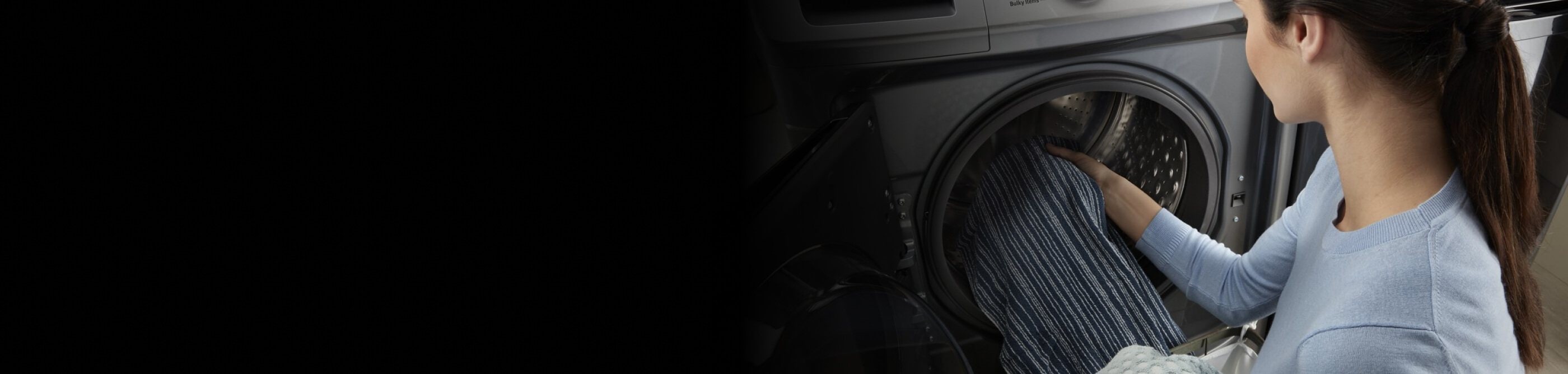 Image of person Image of person taking clothing out of a washer