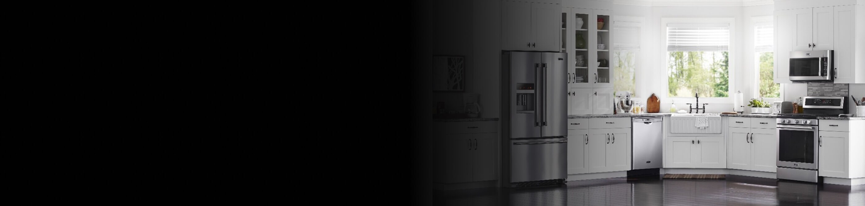 A beautiful, white kitchen with stainless steel appliances