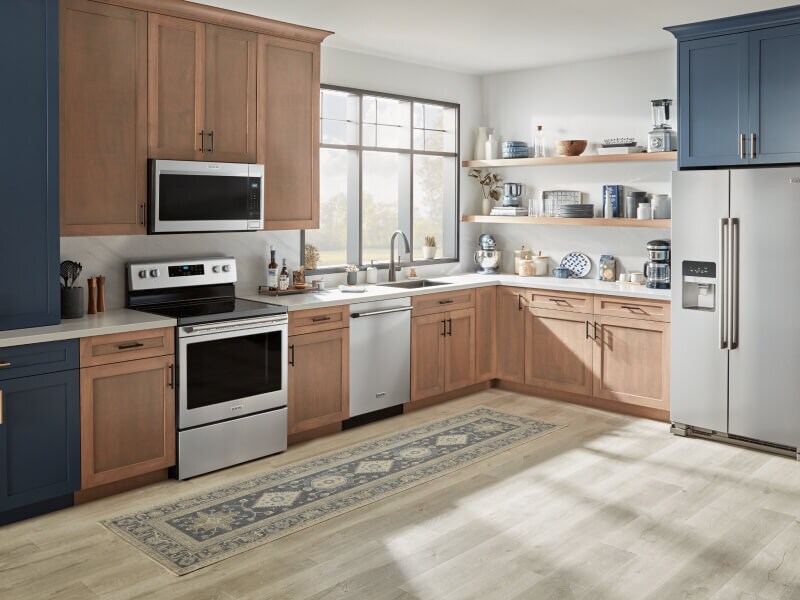 A Maytag® stove, over-the-range microwave, dishwasher and refrigerator in a modern kitchen