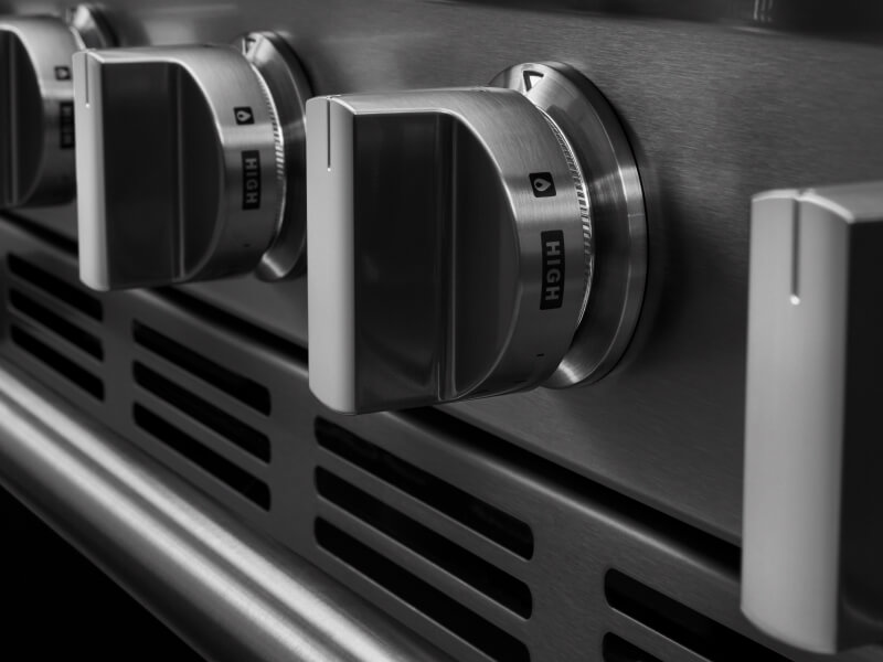 A close up of Maytag® stove cooktop knobs