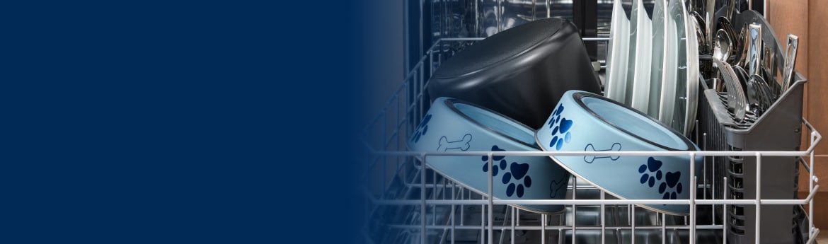 Two blue pet bowls in a dishwasher