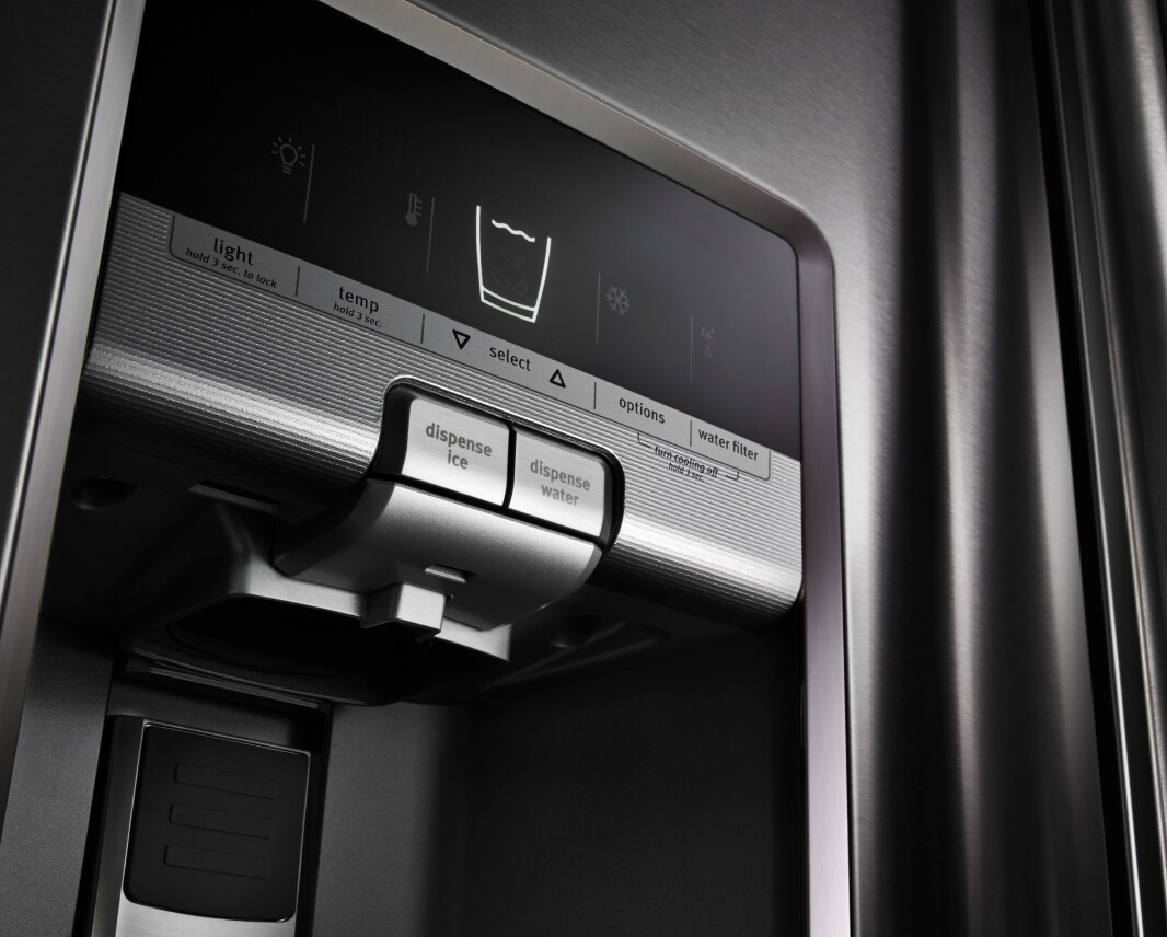 Maytag brand refrigerator with a water dispenser.