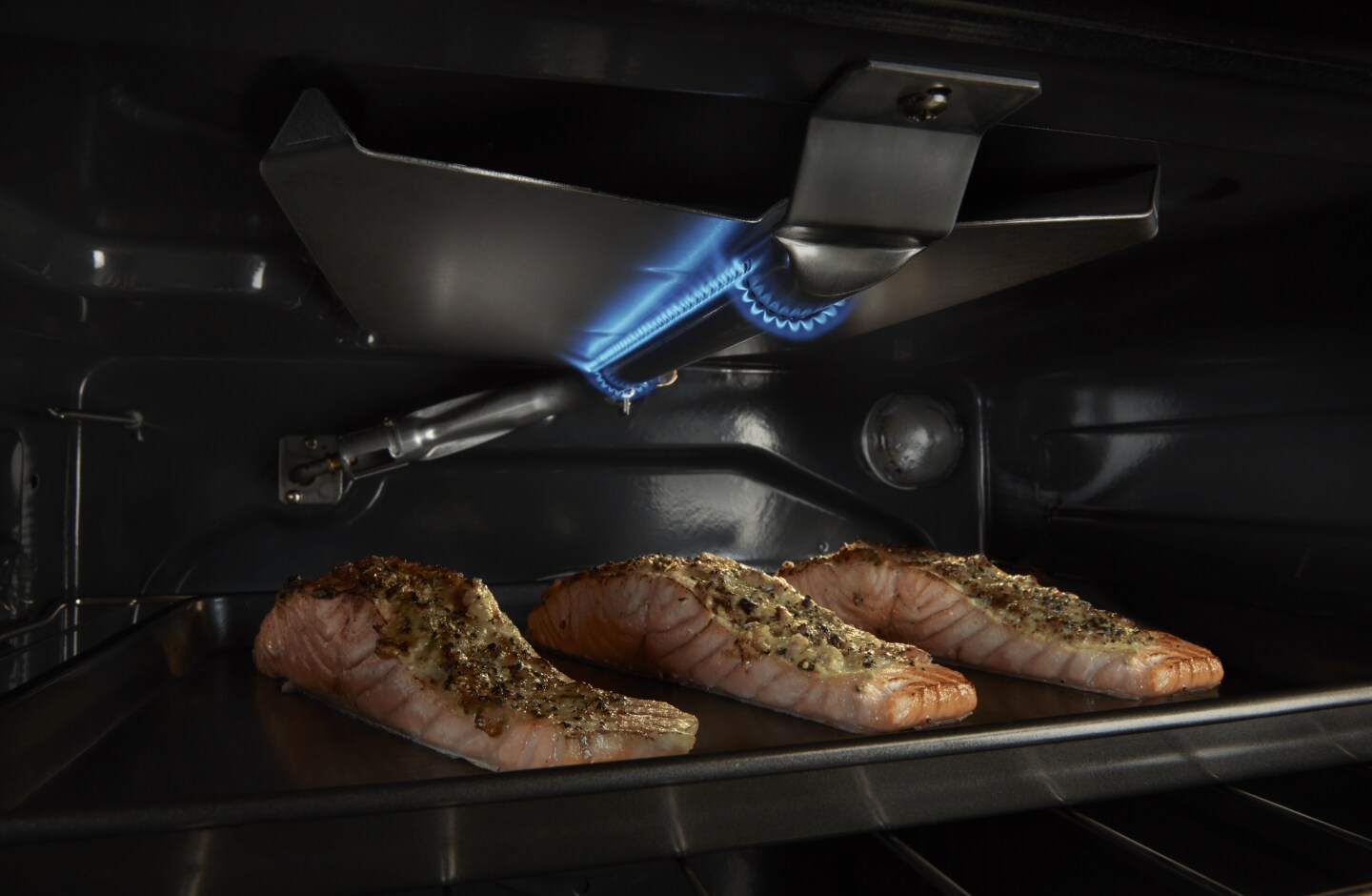 Salmon baking inside an oven Salmon baking inside an oven