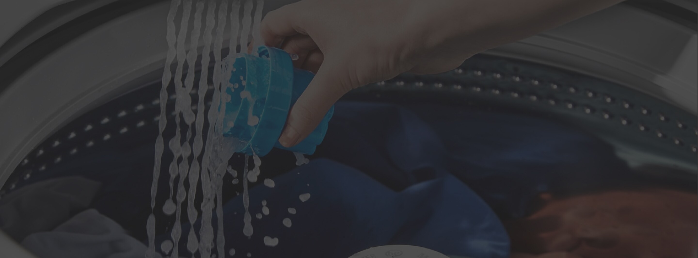 Person pouring detergent into a Maytag® washer