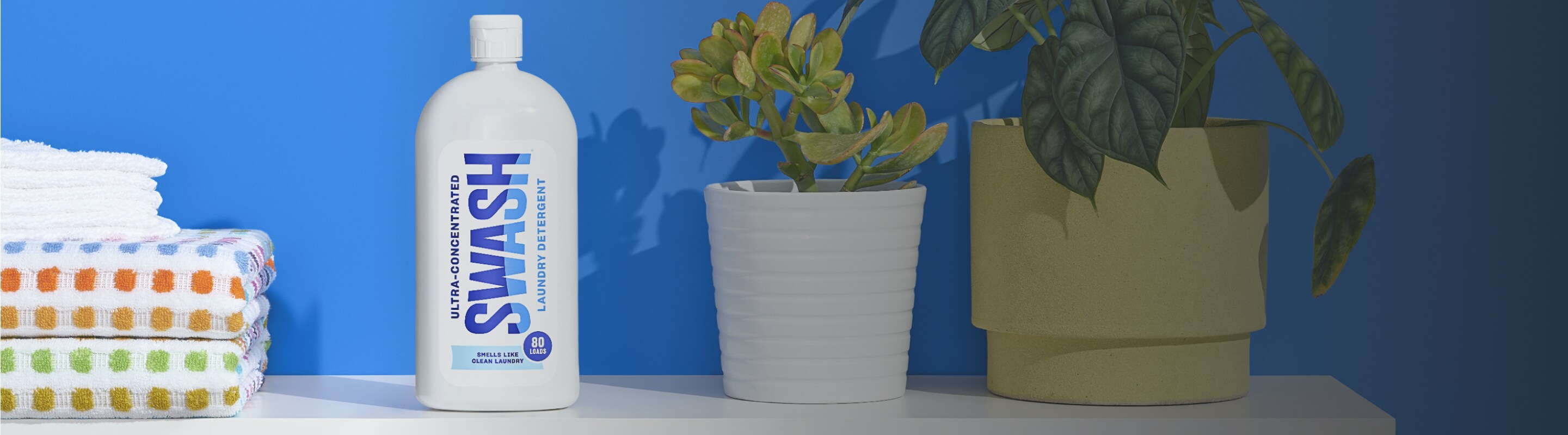 Three bottles of Swash® Laundry Detergent.