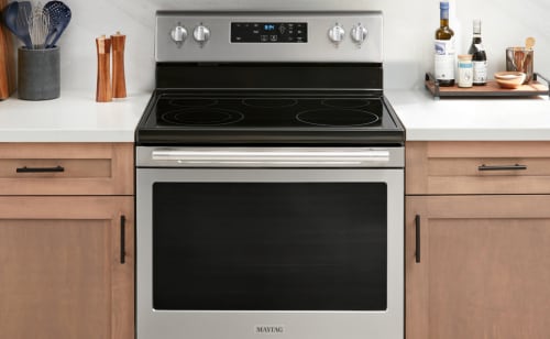 An electric range in the kitchen