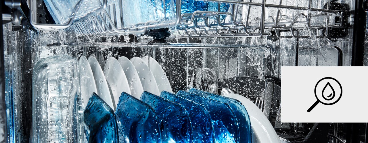 Water spraying inside a dishwasher Water spraying inside a dishwasher