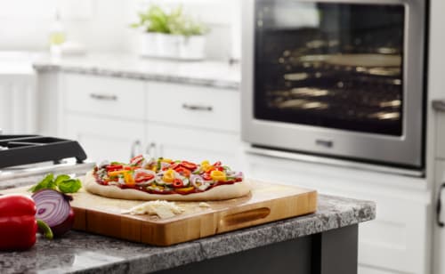 Homemade pizza on a cutting board