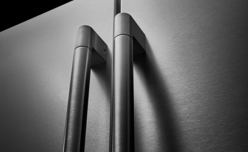 Close-up of stainless steel refrigerator door handles