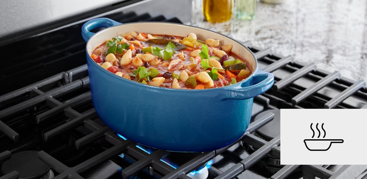 Stew simmering on a gas range with a pan icon