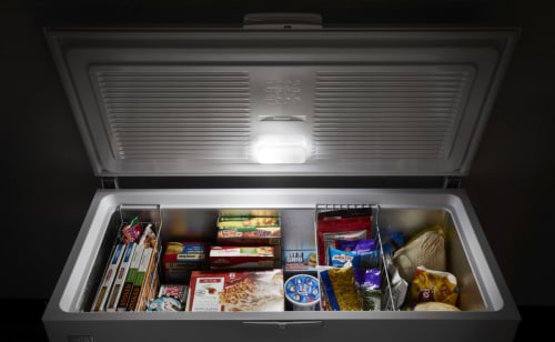 Chest freezer opened showing contents
