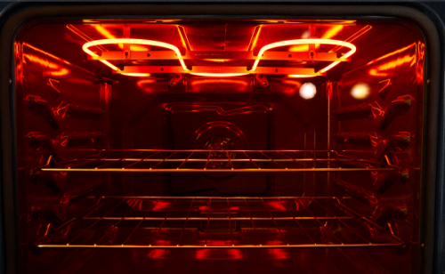 The interior of an oven with a heating element