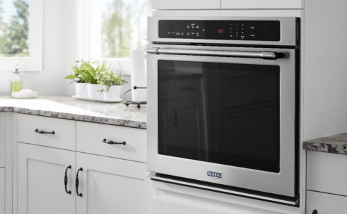 Maytag® wall oven set in white cabinetry