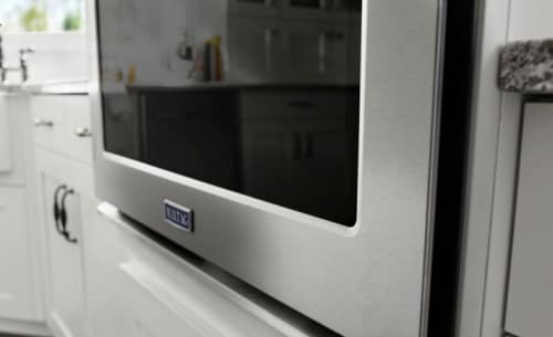 Maytag® Combination wall oven in a white kitchen