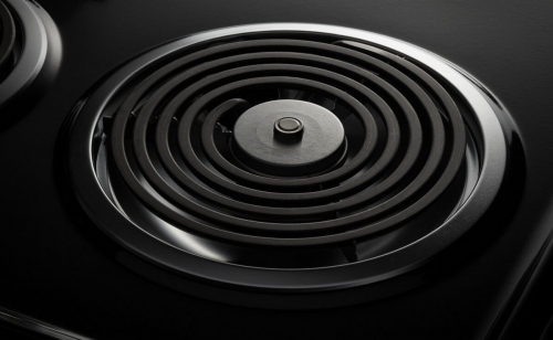 A closeup image of a removable coil from an electric stove.