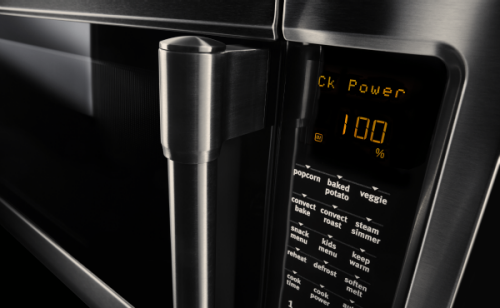 A close up image of a microwave door handle