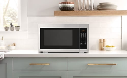 Stainless steel microwave on a countertop