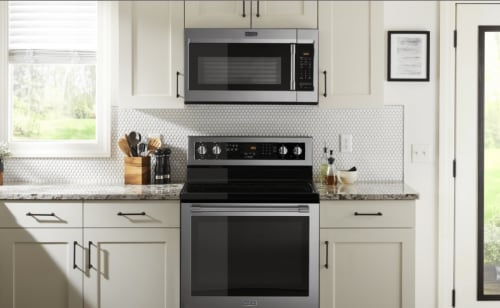 A microwave installed above an oven