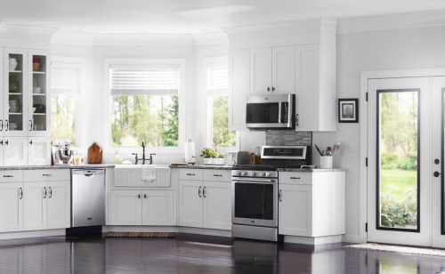 A Maytag® oven and over-the-range microwave in a modern kitchen.