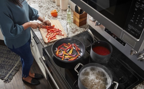 Woman using an electric range