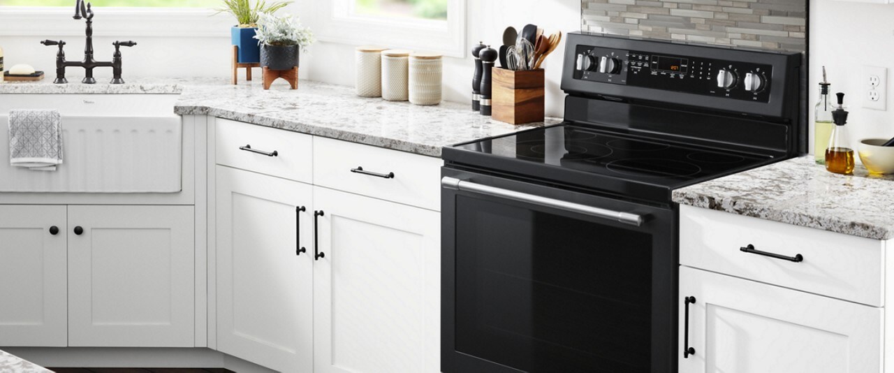 Black freestanding range in a white kitchen Black freestanding range in a white kitchen