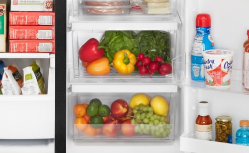 Close-up of produce and frozen food in side-by-side refrigerator
