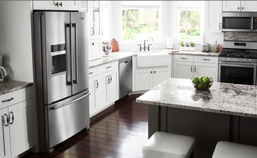 A kitchen featuring a Maytag® refrigerator and freezer.