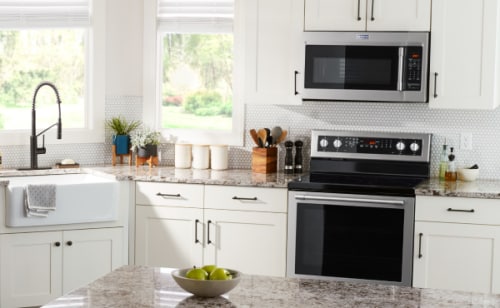 View of modern kitchen with Maytag brand appliances