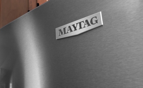 The front of a stainless steel Maytag® refrigerator