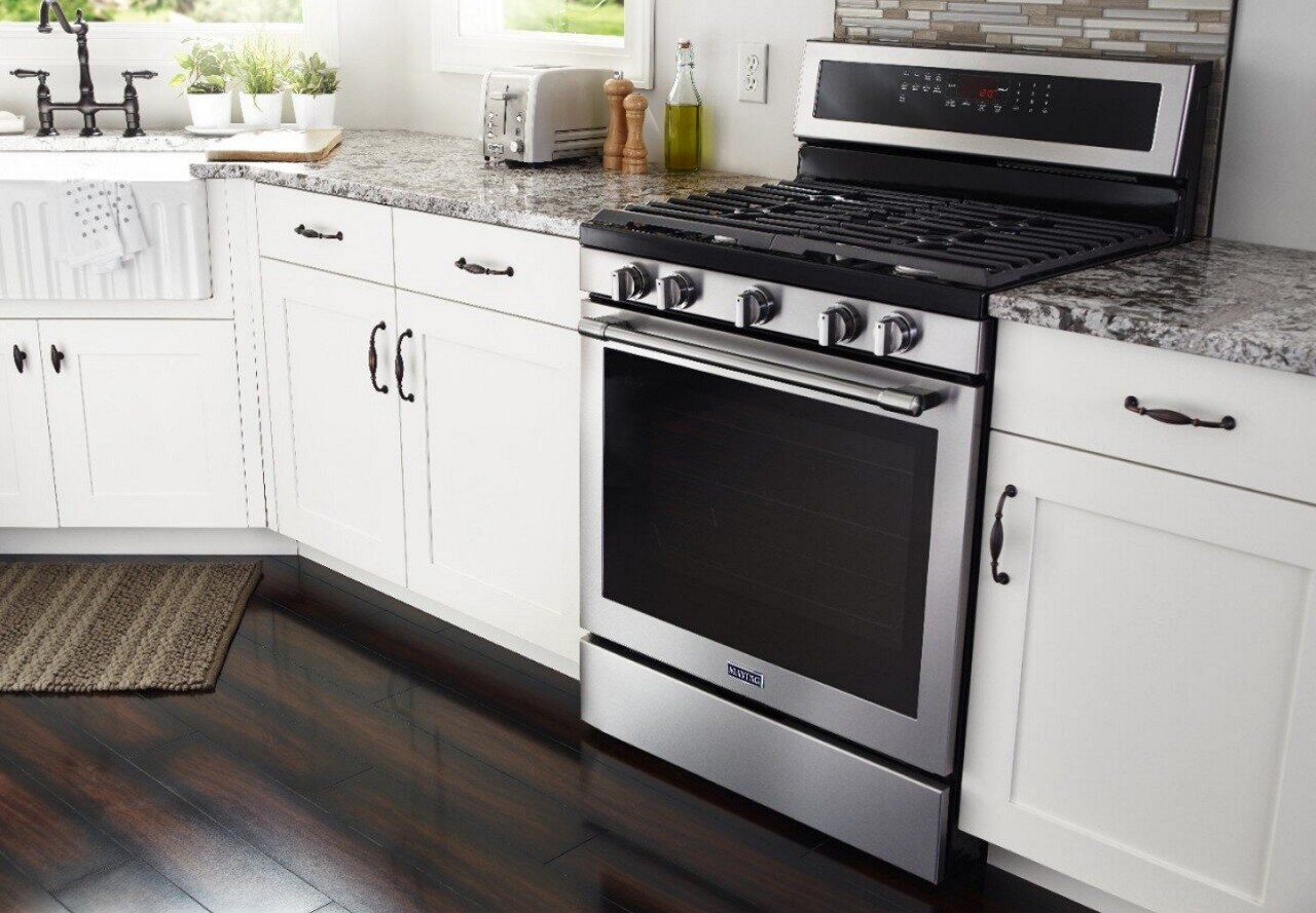 Freestanding gas range in a white kitchen Freestanding gas range in a white kitchen
