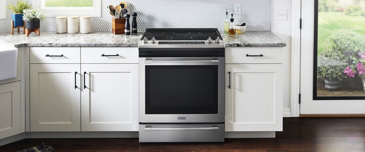 Slide-in electric range in a white kitchen Slide-in electric range in a white kitchen