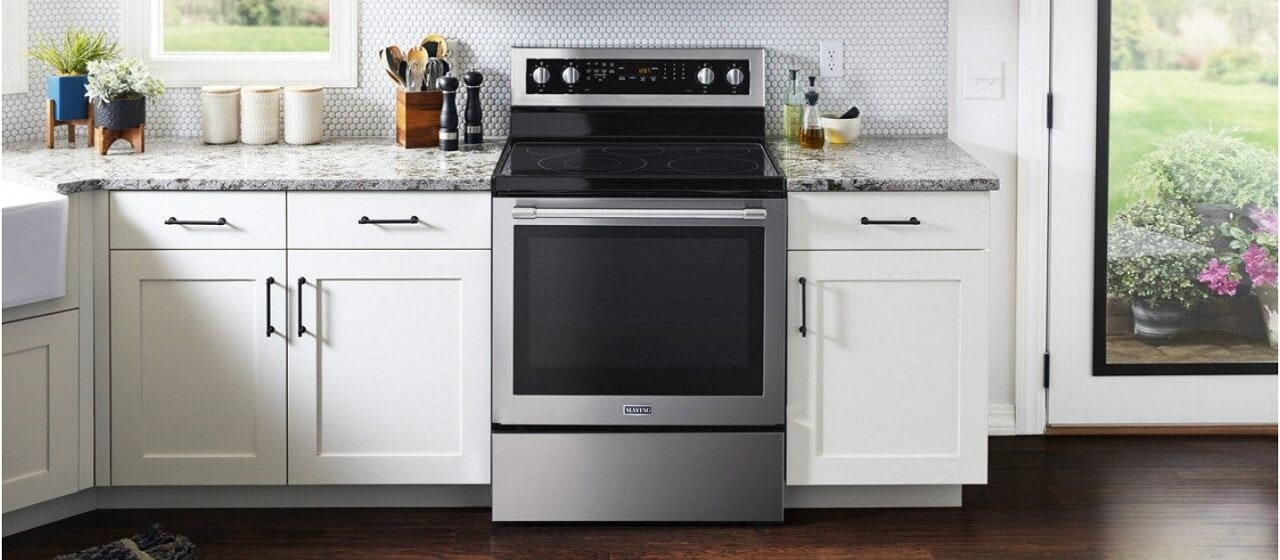Freestanding electric range in a white kitchen