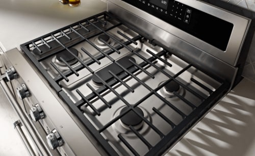 A close up image of stove grates on a gas range.