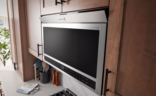 Maytag® over-the-range microwave in brown cabinetry