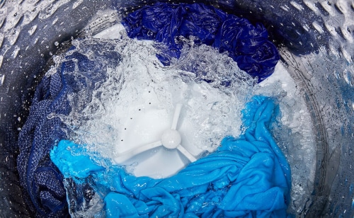 Clothing inside of a washing machine with an impeller