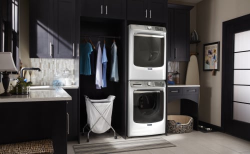 A stackable washer and dryer in a laundry room