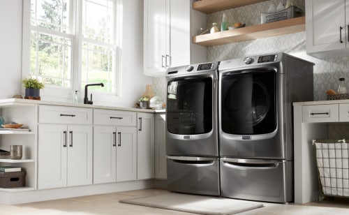 Maytag® dryer in a white laundry room