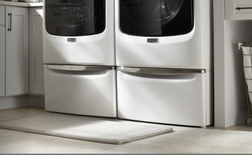 Maytag® washer and dryer on pedestals