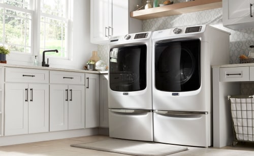 A white, front-load Maytag® washer and dryer set