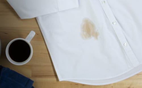 A white shirt with a coffee stain