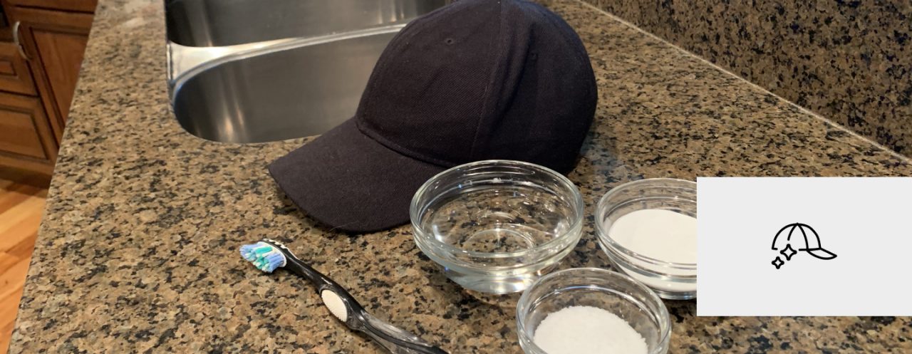 A baseball cap, toothbrush and small bowls of cleaning supplies